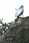 Satellite Dish On Rock Stock Photo