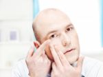 Man Putting Contact Lens In Eye Stock Photo