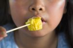 Asian Girl Eating Dumplings Stock Photo