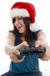 Brunette Female With Christmas Hat And Remote Stock Photo