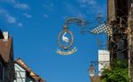 Hanging Sign In Riquewihr In Haut-rhin Alsace France Stock Photo