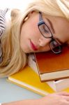 Businesswoman Sleeping On Books Stock Photo