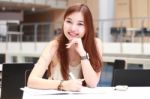 Portrait Of Thai Adult Beautiful Girl Write A Book And Smile In University Stock Photo