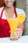 Woman Serving Fresh Orange Juice Stock Photo