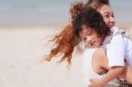 Asian Woman Holding Her Son Stock Photo