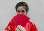 Chinese Woman Holding Red Envelopes Stock Photo