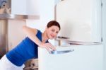 Woman Opening Refrigerator Stock Photo