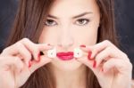 Young Woman Holding Dices Stock Photo