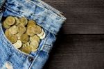 Coin Stack And Blue Jeans Lack Stock Photo