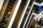 Bangkok, Thailand - September 12, 2013: Shoppers On Escalator At Stock Photo