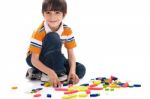 Adorable Caucasian Boy Joining The Blocks Stock Photo