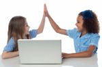 Cute Little School Girls With Laptop Stock Photo