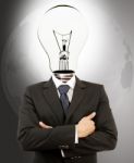 Businessman With Lamp Head Stock Photo