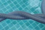 Closeup Swimming Pool Vacumm Hose Twist On Water Surface Background Stock Photo