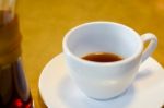 Cup Of Coffee On White Plate And Wood Table Background Stock Photo