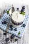 Light Breakfast Setup With Yogurt On White Wooden Table Stock Photo