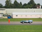 Vintage Car Driving Around Dunsfold Airfield Stock Photo