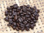 Coffee Beans On Wooden Background Stock Photo