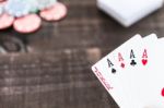 Cards And Poker Chips On Wooden Background Stock Photo