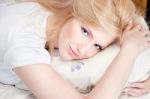 Pretty Woman On Pillow Stock Photo