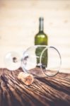 Vintage Cork From Wine Bottle And Glass On The Old Wood Floor Stock Photo