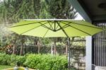 Flaxen Garden Umbrella In Summer Stock Photo