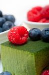 Green Tea Matcha Mousse Cake With Berries Stock Photo