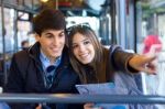 Young Couple Use Their Map And Pointing Where They Want To Go Stock Photo