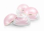 Several Pink Dome Cosmetic Jar On White Background Stock Photo