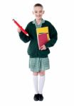 Schoolgirl Holding Books And Pencil Stock Photo