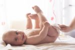 Mom Carefully Clean Baby Skin With Wet Wipes Stock Photo