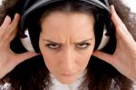 Angry Female Listening Music Stock Photo