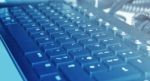 Dusty Keyboard In Blue Light Stock Photo