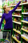 Woman Shopping In Store Stock Photo