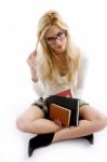 Front View Of Smiling Young Student Holding Books Stock Photo