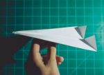 Hand Holding A Paper Airplane Engineering Background Stock Photo