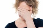 Unhappy Woman Hiding Her Face Stock Photo