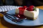 Strawberry Cheesecake With Spoon And Fork Stock Photo