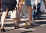 Feet Of The Pedestrians On City Street Stock Photo