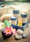 Spa Setting And Candle With Plumeria Or Frangipani Flower On Sto Stock Photo