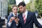 Man Using A Smart Phone On The Street Stock Photo