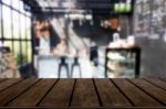 Selected Focus Empty Brown Wooden Table And Coffee Shop Or Resta Stock Photo