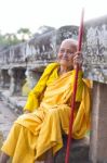 An Unidentified Old Buddhist Female Monk Dressed In Orange Toga Stock Photo