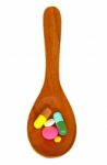 Wooden Spoon With Pills Stock Photo