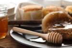 Wood Honey Dipper With Soft Cake Still Life Closeup Stock Photo