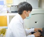 Asia Scientist Working In Biological Laboratory Stock Photo