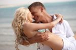 Romantic Couple Playing At Beach Stock Photo