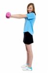 Pretty Teen Working Out With Pink Dumbbells Stock Photo