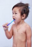 Baby And Toothbrush Stock Photo