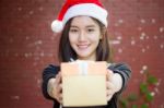 Portrait Of Thai Adult Student University Beautiful Girl Hold Gift Box In Hands Stock Photo